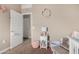 Bright bedroom with built-in shelving and plush seating at 36545 N Herens Rd, San Tan Valley, AZ 85143