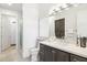 Modern bathroom with a walk-in shower, toilet and double vanity with marble countertop at 5250 E Deer Valley Dr # 406, Phoenix, AZ 85054