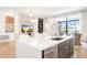 Modern kitchen island with white quartz countertops and stainless steel appliances at 5250 E Deer Valley Dr # 406, Phoenix, AZ 85054