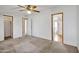 Simple bedroom with carpet flooring and access to a bathroom and closet at 535 S Alma School Rd # 45, Mesa, AZ 85210