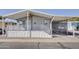 Front view of a mobile home with covered porch and walkway at 535 S Alma School Rd # 45, Mesa, AZ 85210