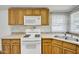 View of kitchen stovetop and double sink at 535 S Alma School Rd # 45, Mesa, AZ 85210