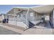 Mobile home exterior with covered carport and stairs at 535 S Alma School Rd # 45, Mesa, AZ 85210