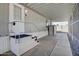 Side yard of the mobile home with covered walkway and storage at 535 S Alma School Rd # 45, Mesa, AZ 85210