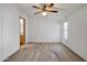 Bright bedroom with ceiling fan and adjacent bathroom at 535 S Alma School Rd # 45, Mesa, AZ 85210