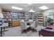 Community library with bookshelves and small seating area at 535 S Alma School Rd # 45, Mesa, AZ 85210