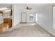 Spacious living room featuring neutral carpeting and a ceiling fan at 535 S Alma School Rd # 45, Mesa, AZ 85210