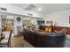 Comfortable lounge area with leather couches, a TV, and a library at 535 S Alma School Rd # 45, Mesa, AZ 85210
