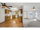 Open kitchen with wood cabinets, appliances, and wood flooring at 535 S Alma School Rd # 45, Mesa, AZ 85210