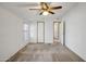 Bright bedroom with ceiling fan and access to closets and bathroom at 535 S Alma School Rd # 45, Mesa, AZ 85210