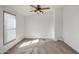 Bright bedroom with carpeted floors and ceiling fan at 535 S Alma School Rd # 45, Mesa, AZ 85210