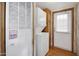 Stackable washer and dryer in a compact laundry room with wood flooring at 535 S Alma School Rd # 45, Mesa, AZ 85210