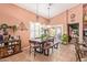 Bright dining area with wooden table, bench, and access to backyard at 9576 W Blue Sky Dr, Peoria, AZ 85383