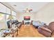 Gathering room features hardwood floors and ceiling fan at 17434 W Madison St, Goodyear, AZ 85338