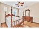 Bedroom with wood floors and antique furniture at 17434 W Madison St, Goodyear, AZ 85338