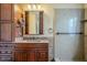 Bathroom vanity with wood cabinets, a mirror, and light fixture at 2124 E Osborn Rd, Phoenix, AZ 85016