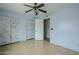 Bedroom showcasing wood-look flooring, closet doors, and access to another room at 2124 E Osborn Rd, Phoenix, AZ 85016