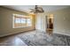 Spacious bedroom with wood floors, ceiling fan, bay window, and ensuite bathroom at 2124 E Osborn Rd, Phoenix, AZ 85016