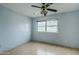 Bedroom with wood-look flooring, light blue walls, and a ceiling fan at 2124 E Osborn Rd, Phoenix, AZ 85016