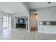 Living room featuring tile flooring, a ceiling fan, and an entertainment center at 2124 E Osborn Rd, Phoenix, AZ 85016