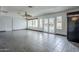Sunroom with tiled floors, ceiling fan, large windows, and outdoor access at 2124 E Osborn Rd, Phoenix, AZ 85016