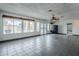 Spacious sunroom with tile floor, ceiling fan, and windows overlooking the backyard at 2124 E Osborn Rd, Phoenix, AZ 85016
