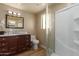 Bathroom with dark vanity, marble countertop, and a shower stall at 4532 E Superstition Blvd, Apache Junction, AZ 85119