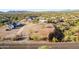 Aerial view of vacant lot with mountain views and neighboring houses at 4532 E Superstition Blvd, Apache Junction, AZ 85119