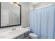 Clean bathroom with light blue shower curtain at 17986 W Fulton St, Goodyear, AZ 85338