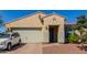 Single-story home with a two-car garage and landscaped yard at 17986 W Fulton St, Goodyear, AZ 85338