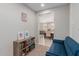 Playroom with bookshelf and couch at 17986 W Fulton St, Goodyear, AZ 85338
