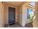 Inviting front entry with a gray door at 17986 W Fulton St, Goodyear, AZ 85338