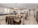 Dining area with large table and access to the kitchen at 17986 W Fulton St, Goodyear, AZ 85338