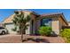 Charming house exterior, features a tree at 17986 W Fulton St, Goodyear, AZ 85338