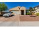 Single-story home with a two-car garage and landscaped yard at 17986 W Fulton St, Goodyear, AZ 85338