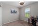 Bright bedroom with a desk and window shutters at 17986 W Fulton St, Goodyear, AZ 85338