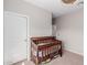 Bedroom with crib and closet at 17986 W Fulton St, Goodyear, AZ 85338