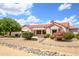 Side view of the house showcasing its attractive landscaping at 17621 N Eagle Crest Dr, Surprise, AZ 85374