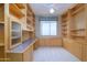 Spacious home office with built-in shelves and desk at 17621 N Eagle Crest Dr, Surprise, AZ 85374