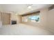 Spacious living room with fireplace and large windows at 17621 N Eagle Crest Dr, Surprise, AZ 85374