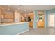 Kitchen boasts light wood cabinets and a breakfast bar at 17621 N Eagle Crest Dr, Surprise, AZ 85374