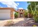 Welcoming entryway with a stone facade and lush landscaping at 17621 N Eagle Crest Dr, Surprise, AZ 85374