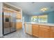 Kitchen features stainless steel appliances and light wood cabinets at 17621 N Eagle Crest Dr, Surprise, AZ 85374