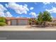 Stunning curb appeal with a two-car garage and desert landscaping at 17621 N Eagle Crest Dr, Surprise, AZ 85374