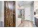 Bathroom with barn door, soaking tub, glass shower, and dark vanity at 4145 S Zephyr --, Mesa, AZ 85212