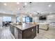 Open concept kitchen with large island, breakfast nook, and view into living room at 4145 S Zephyr --, Mesa, AZ 85212