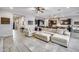 Open living room featuring a spacious sectional sofa and tile flooring at 4145 S Zephyr --, Mesa, AZ 85212