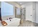 Spa-like bathroom with a soaking tub, glass shower, and modern fixtures at 4145 S Zephyr --, Mesa, AZ 85212