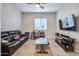 Cozy Gathering room with leather couch and large TV at 4145 S Zephyr --, Mesa, AZ 85212
