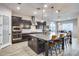 Spacious kitchen with an expansive island, dark cabinetry, and ample counter space at 4145 S Zephyr --, Mesa, AZ 85212